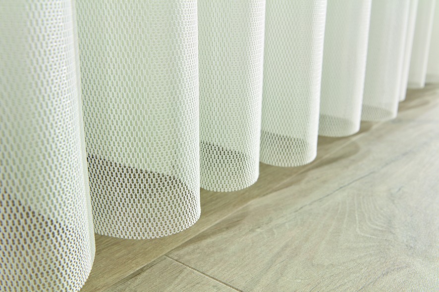 Close-up of allusion blind fabric vanes