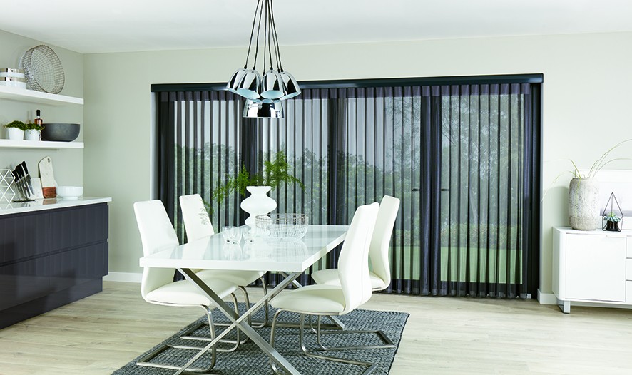 Pewter allusion blind fitted across patio doors in a dining room