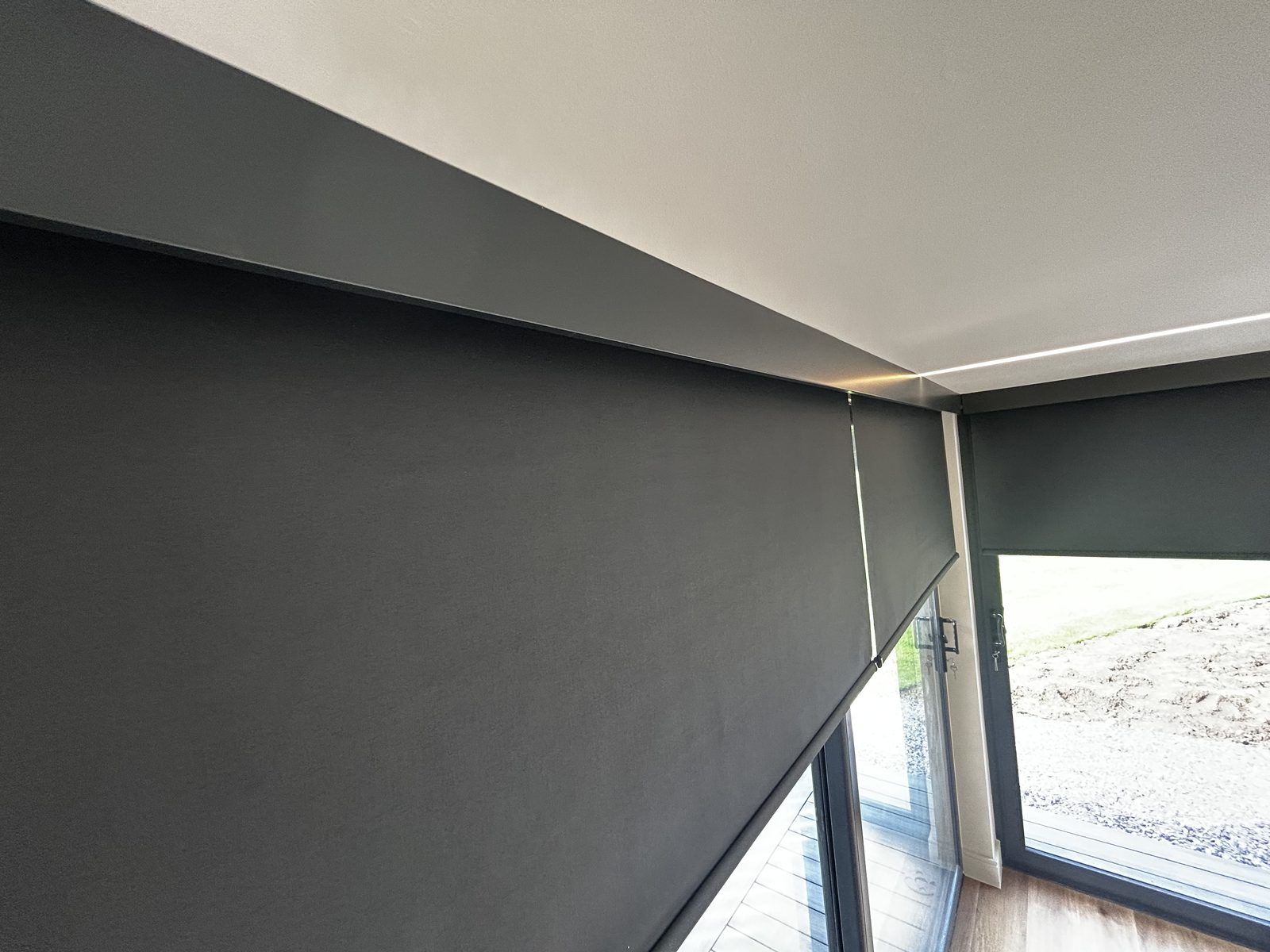 Blackout roller blind fitted in a garden room