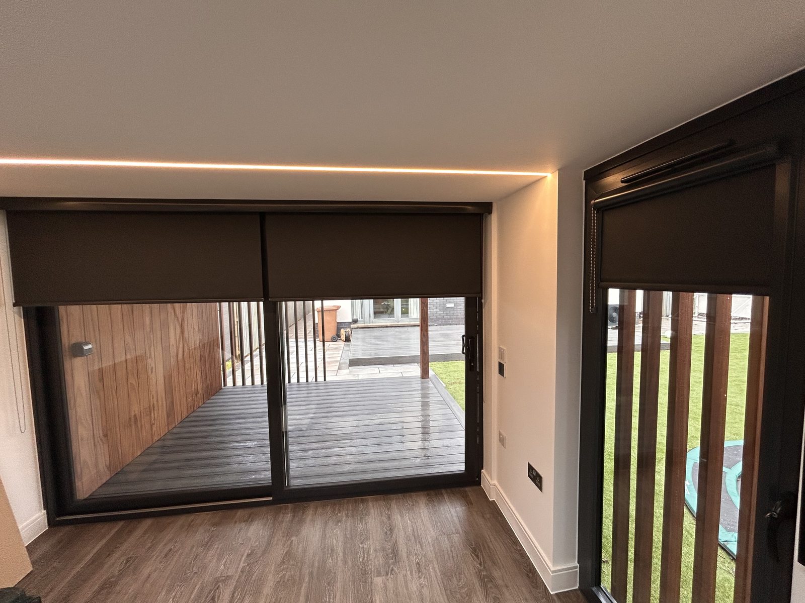 Motorised roller blinds fitted in a garden room
