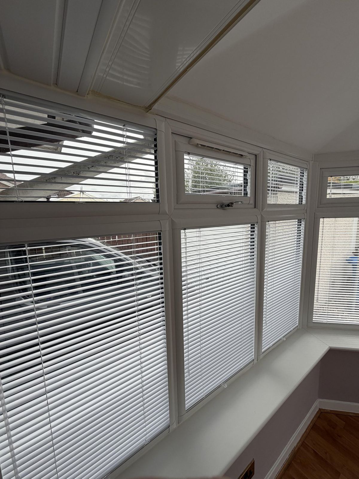 Perfect Fit venetian blinds fitted to a conservatory bay window