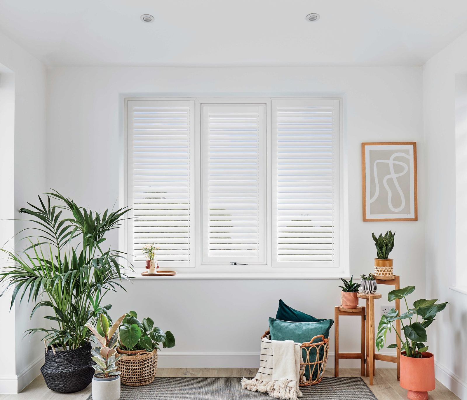 Perfect Fit shutters fitted in a study with plants