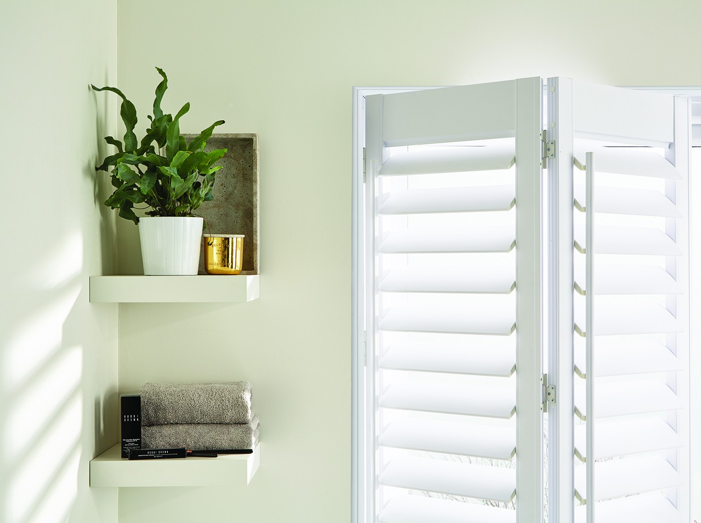 Close-up of PVC shutter hinge and louvre detail in a bathroom
