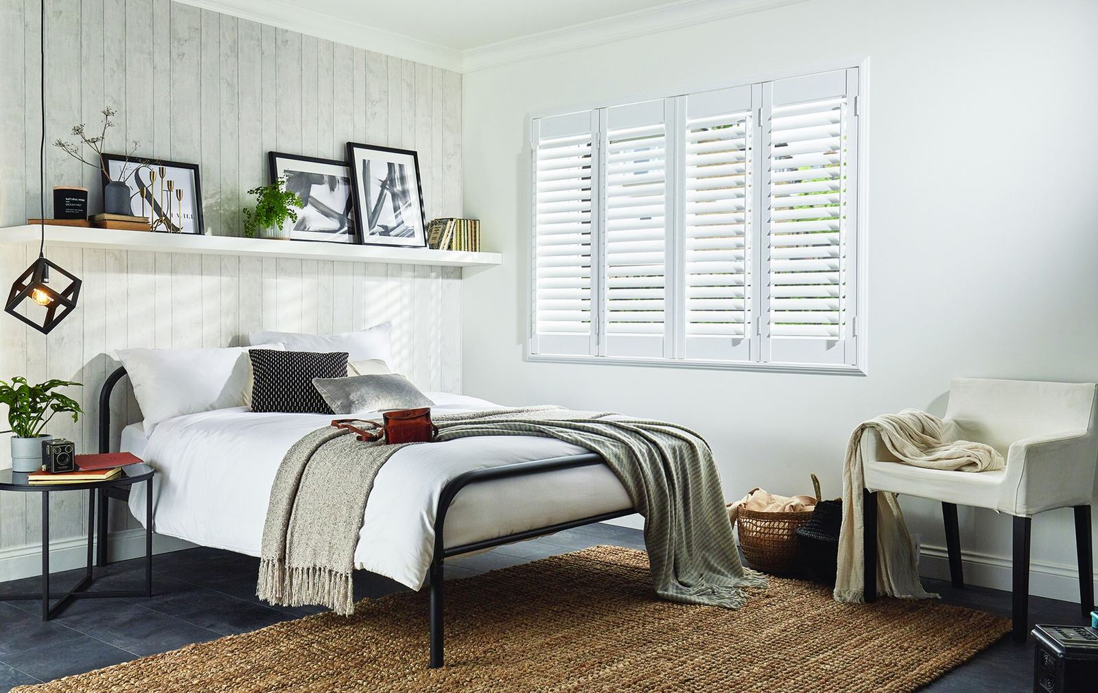 Bi-fold PVC shutters fitted in a bedroom
