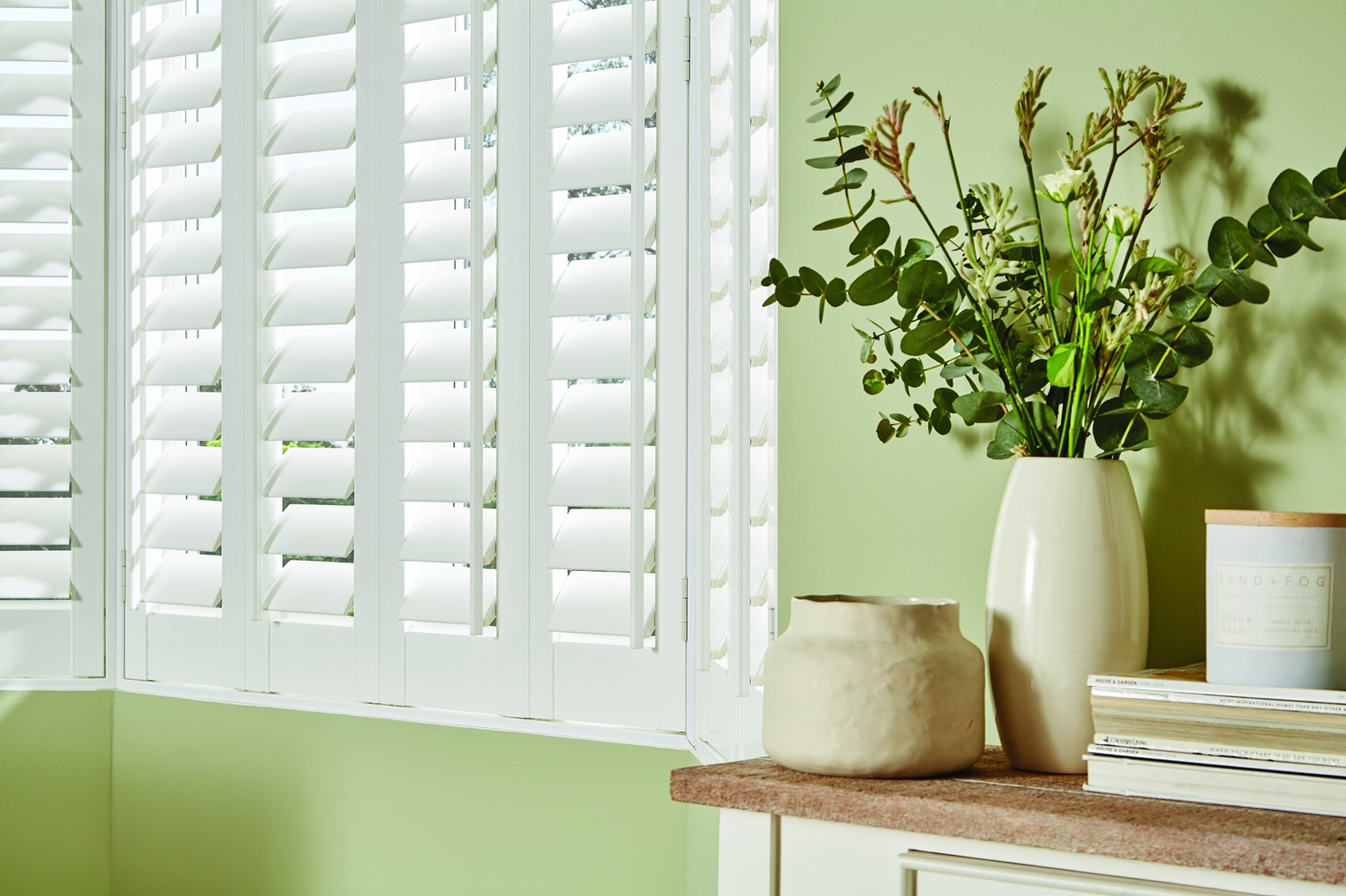 PVC shutters fitted to a bay window