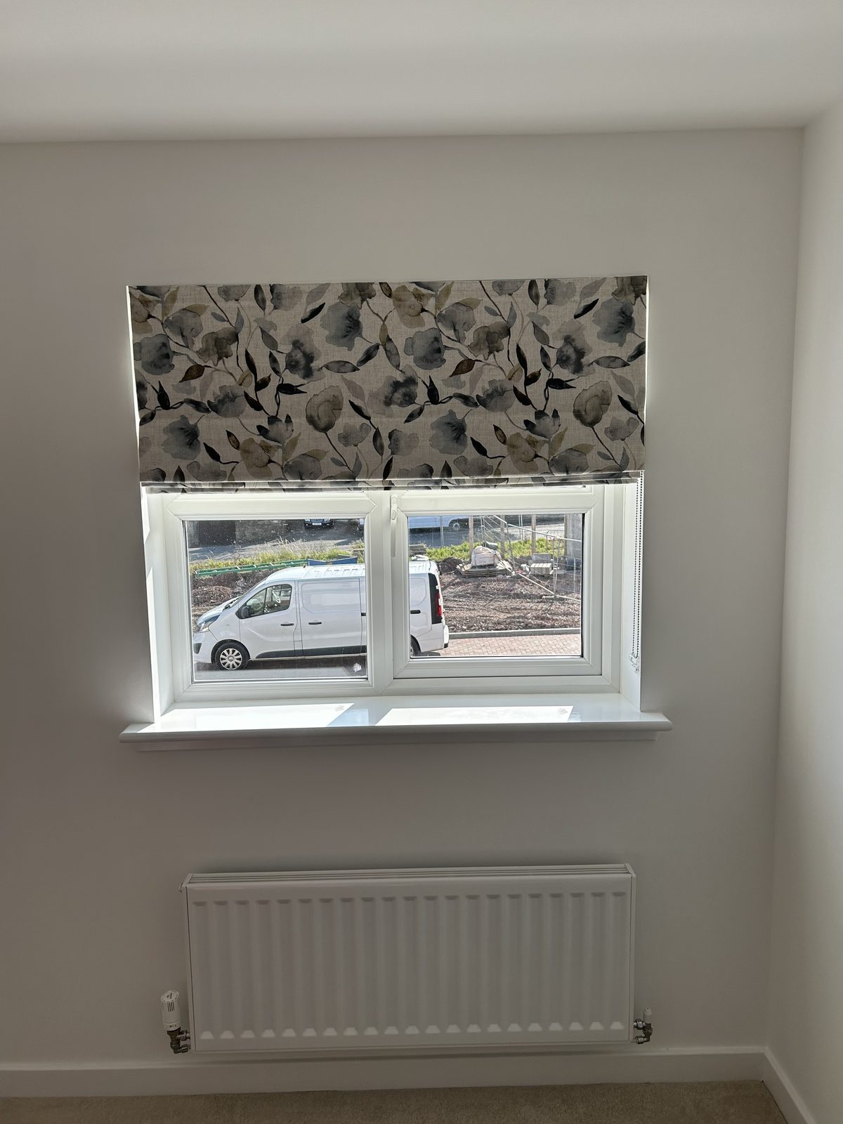 Roman blind installed in a living room