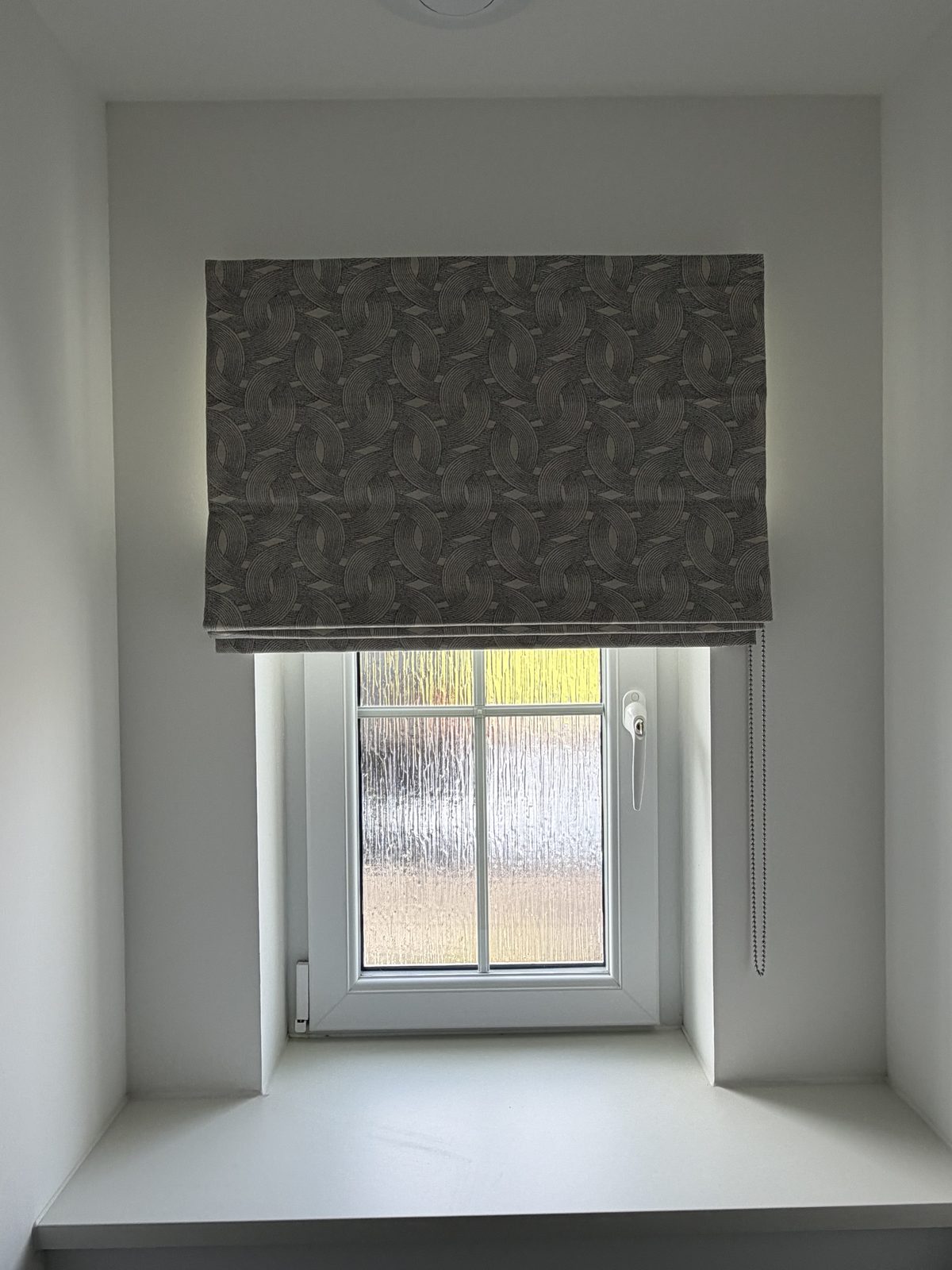 Roman blind installed in a living room
