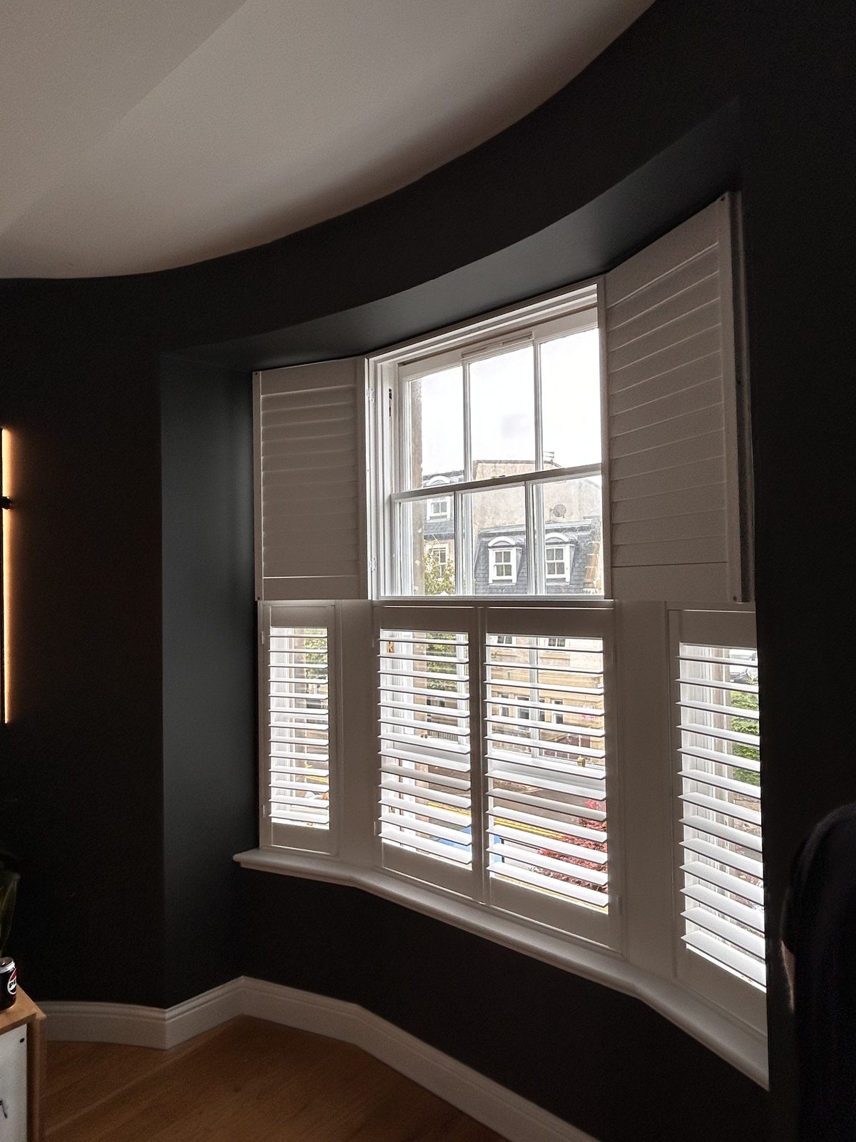 Tier on tier wooden shutters fitted to a bay window, Edinburgh
