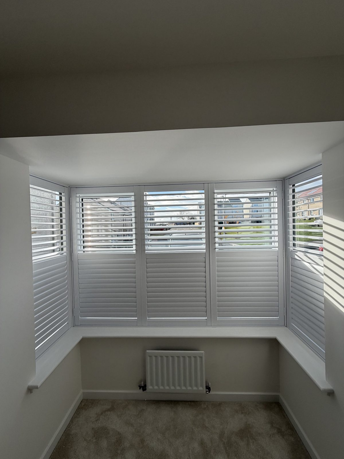 Shutters fitted in a bedroom