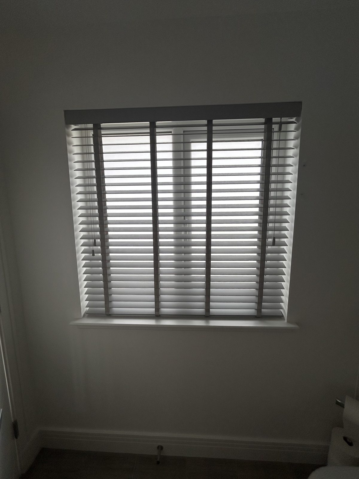 Venetian blind fitted in a room